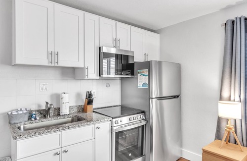 Treasure Island Apartment | 🌞400 ft to the Beach👙Onsite Heated Pool🐬Bungalows #8🌴Grills🐶Dogs Welcome!