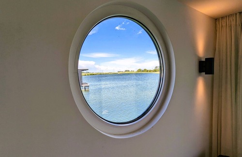 Wangerland Boat Rental | 45 m² houseboat with 40 m² roof terrace, modern furnishings. See photos!