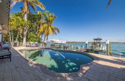 North Redington Beach House | 4bd 2ba Waterfront House with Pool, Hot Tub & Boat!