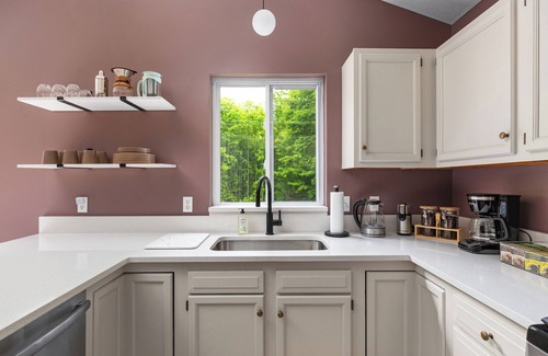 Traverse City House | 4bdr 2 bath house. Unwind in the hot tub, chat around the fire pit and disc golf