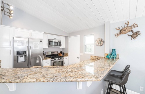 Balboa Peninsula Condo | 4BR Coastal Getaway between the Bay & Beach | Sunny Patio & Balcony!