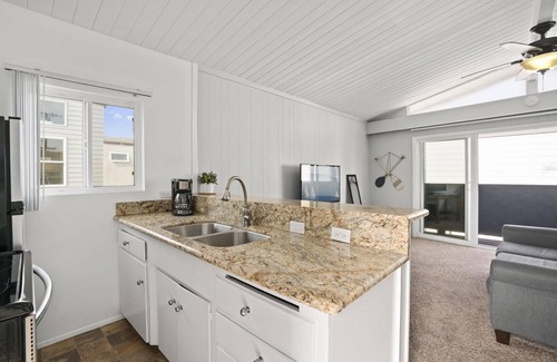 Balboa Peninsula Condo | 4BR Coastal Getaway between the Bay & Beach | Sunny Patio & Balcony!