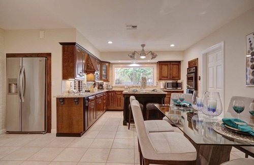 Coral Ridge House | 4BR Heated Pool Home with Tiki Hut!