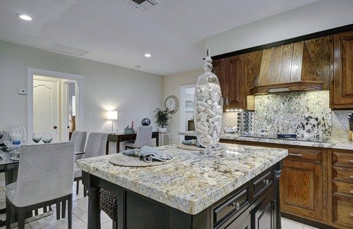 Coral Ridge House | 4BR Heated Pool Home with Tiki Hut!