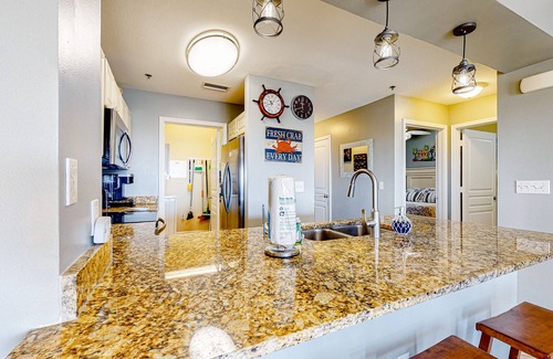Waterside Village Condo | 4th-floor canal view condo with balcony, pool/hot tub access, washer/dryer & AC