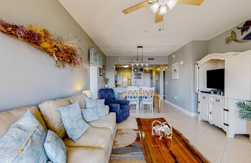 Waterside Village Condo | 4th-floor canal view condo with balcony, pool/hot tub access, washer/dryer & AC