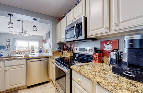 Waterside Village Condo | 4th-floor canal view condo with balcony, pool/hot tub access, washer/dryer & AC