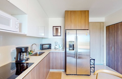 Jaco Apartment | 4th-floor condo with water view, on-site pool, private balcony, & W/D