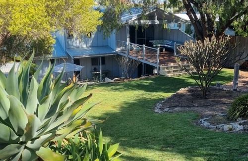 Falcon House | 5 minutes walk to the beach from this family beach house.