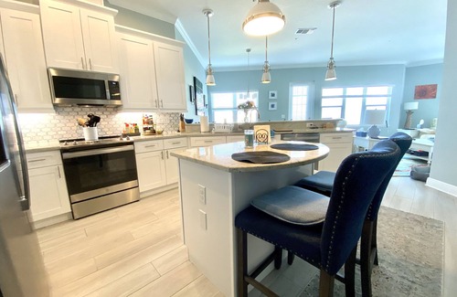 Whitney Beach Condo | 5 Star Resort Style Luxury Condo top floor bay views 3 miles to Beach