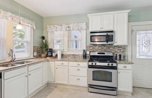 John Ball Park Apartment | 5BR/3BA Near Downtown & Medical Mile Fenced Yard