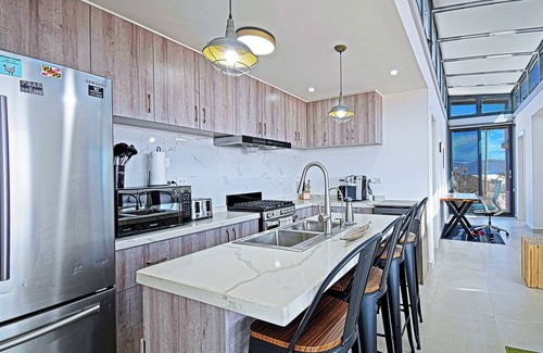 El Sargento House | 5BR/4BA repurposed shipping containers. Game room w/darts, shuffleboard, video games, new 8 person hot tub, multiple decks w/firepits, fast Wifi (250 mb+)w/Starlink backup. Use of SUPs & beach chairs/shade/games. Daily housekeeping optional.