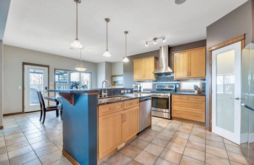 Chestermere House | 5BR Gem w/Pizza Oven, Theater & Views