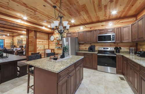 Caton Cabin | 6 King Master Suites, Large Pool, Grill, Hot Tub, Game Room and Theater!