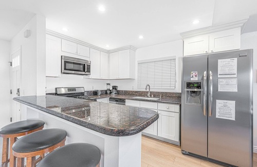 West Newport Condo | 6BR Beach House with A/C | Sunny Patio | Balcony with Ocean Views!