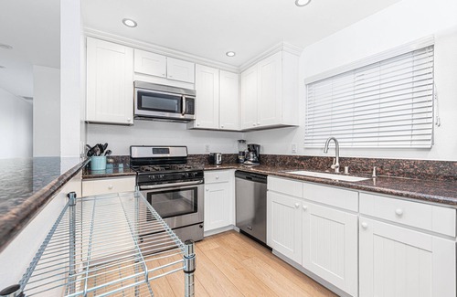 West Newport Condo | 6BR Beach House with A/C | Sunny Patio | Balcony with Ocean Views!