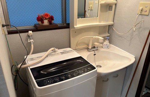 Tenokuchi-cho Apartment | 70 square meters in size with modern tatami mats. A spacious and open room with a harmony of traditional Japanese and Western styles.