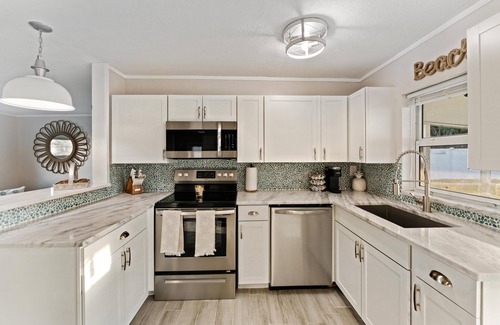 Jensen Beach House | 8 Minutes from numerous beaches, hot tub and beautiful fire pit
