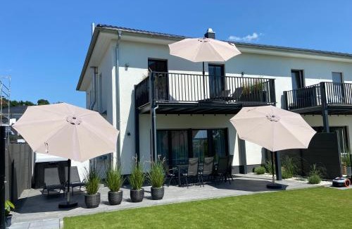 Muldestausee House | 8 Personen Ferienhaus ,Seegelblick" am Goitzschesee, erste Reihe am Strand mit Sauna, Whirlpool, Kamin, Wallbox & SUP