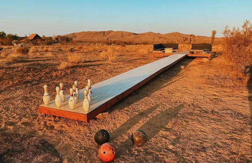 Yucca Valley House | 80s dreamworld with waterfall lagoon, bowling lane, hot tub under the Milky Way