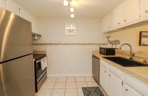 Butler Beach Apartment | 9A Creston House Pool Side Beauty