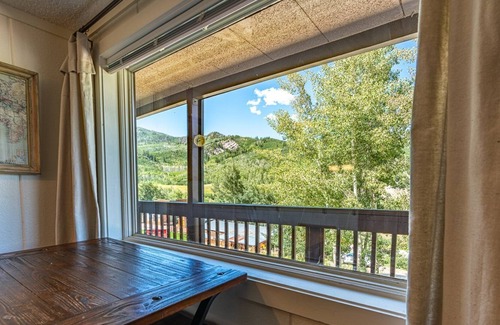 Glenwood Springs Condo | A bedroom alcove maximizes sleeping privacy in this condo.