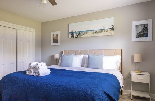Shawnee Apartment | A charming bedroom with a king bed in quiet Shawnee neighborhood near highways.