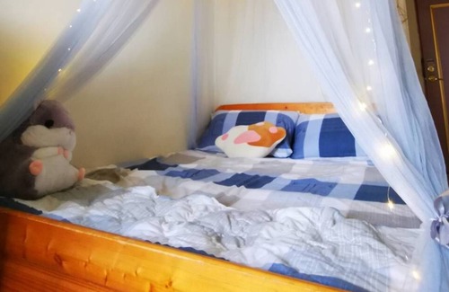 East District Apartment | A cozy room with story from FaFa