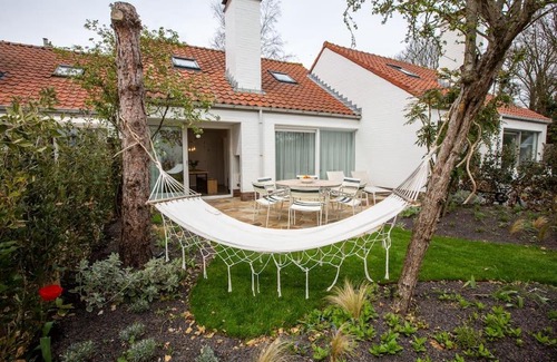 Nieuwpoort House | 'A little white house with a tree by the sea' with beach cabin by BLOSS