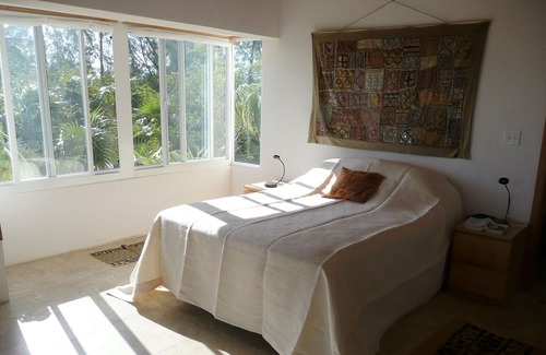 Winding Bay Villa | A luxury beachfront villa, surrounded by palms, with superb views of Winding Bay