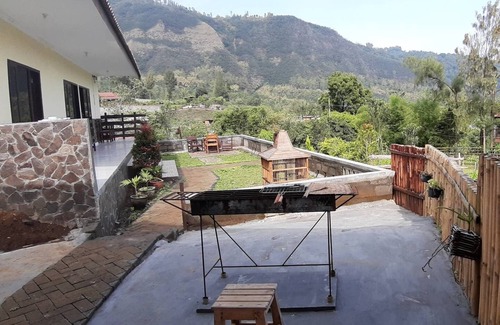 Ngadisari Apartment | A nice bedroom with a great mountain view , 15km from Bromo
