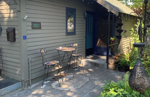 The Dalles Apartment | A shady retreat within a flower garden, with a boutique hotel feel. Close in