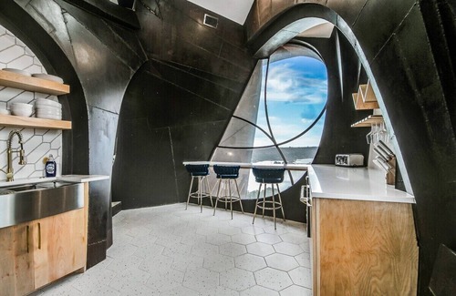 Ransom Canyon House | A stay like no other—inside an iconic steel sculpture with panoramic canyon and lake views.