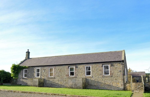 Wandylaw Cottage | A stylish cottage with rural views towards the coastline from the patio.