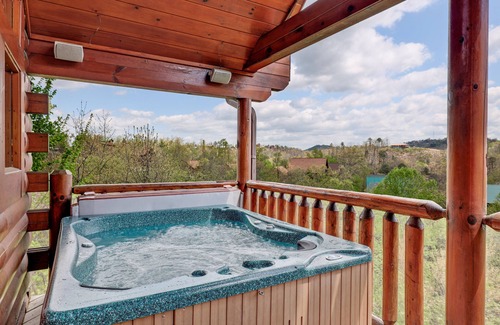 Gatlinburg - Pigeon Forge Cabin | A Taste Of Honey is a dog-friendly two-bedroom true-log cabin nestled inside the Starr Crest resort.