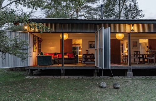 Naivasha House | A unique, eco-friendly hideaway with walls that open to the savannah, allowing safari wildlife viewing from the comfort of the living room.