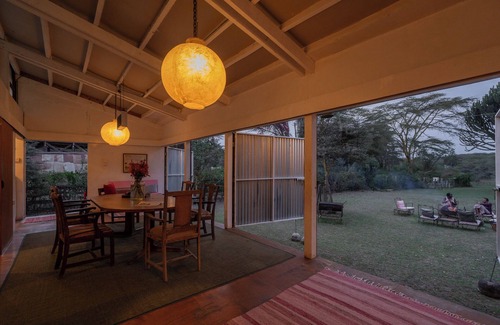 Naivasha House | A unique, eco-friendly hideaway with walls that open to the savannah, allowing safari wildlife viewing from the comfort of the living room.