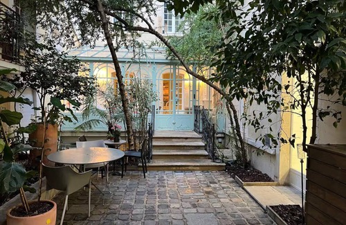 Arsenal Apartment | A Verdant Escape:580m2:Expansive Townhouse Nestled in a Marais Cul-de-Sac