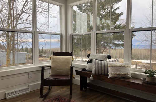 Grand Marais House | A view of Lake Superior set in the middle of a working farm