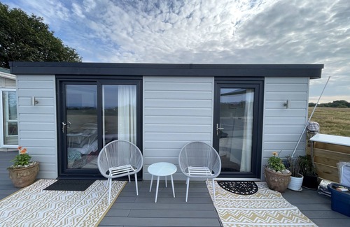 Abersoch Apartment | Abersoch studio with a decking area with amazing views.