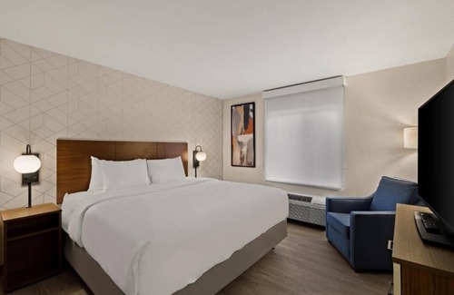 Brownsville Hotel | Accommodates 3 Suites | King Bed + Kitchen & Sofa