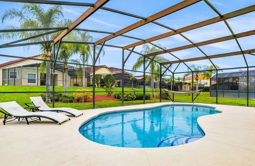 Lake Wilson Preserve House | Affable home with pool, lanai, grill, Pack-N-Play, & kitchen - snowbird-friendly
