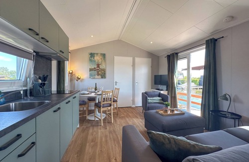 Municipality of Stichtse Vecht Boat Rental | Air-conditioned chalet with a waterside terrace
