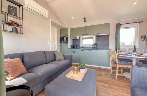 Municipality of Stichtse Vecht Boat Rental | Air-conditioned chalet with a waterside terrace