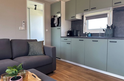 Municipality of Stichtse Vecht Boat Rental | Air-conditioned chalet with a waterside terrace