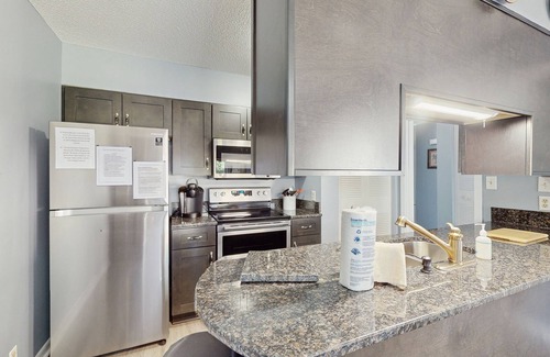 Little River House | All-suite Bay Tree retreat with al fresco dining, water views, and shared pool