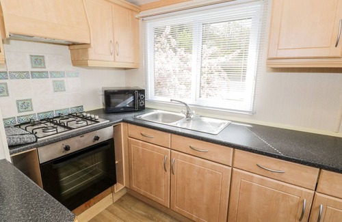 Rhyd-y-foel Cottage | ALPINE LODGE, family friendly, with a garden in Rhyd-Y-Foel