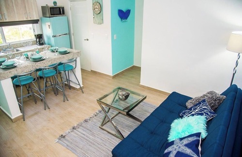 Luis Donaldo Colosio Condo | Amazing 2 BD 2 Bath | Rooftop patio & pool | Walk to beach | Family friendly