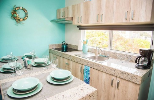 Luis Donaldo Colosio Condo | Amazing 2 BD 2 Bath | Rooftop patio & pool | Walk to beach | Family friendly