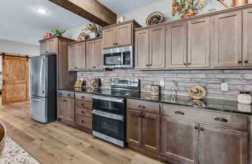 Indian Point House | Amazing Lake Views! Luxury Private Hot Tub-Indoor Pool-Pets -SDC 1 Mile-Sleep 23 | Vintage Canoe